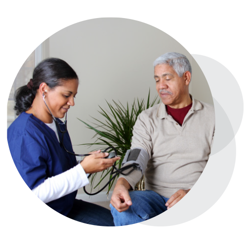 A physician checks a patient's blood pressure.