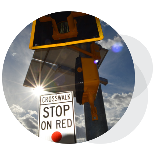 A close up of a crosswalk signal and signage.