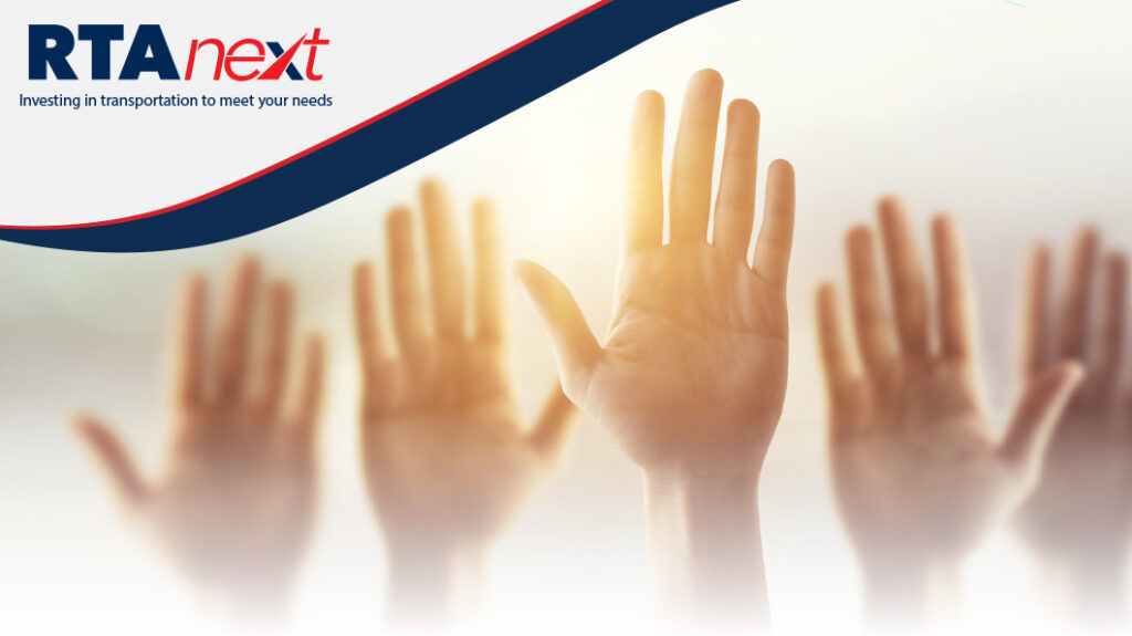 The open palms of several people raising their hands.